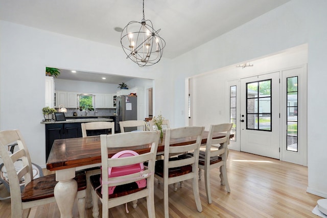 11976 N Northern Hts Dr, Brighton, MO 65617 - dining room with a chandelier and light wood-type flooring