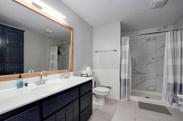 11976 N Northern Hts Dr, Brighton, MO 65617 - bathroom with tile patterned flooring, vanity, toilet, a stall shower, and tile walls