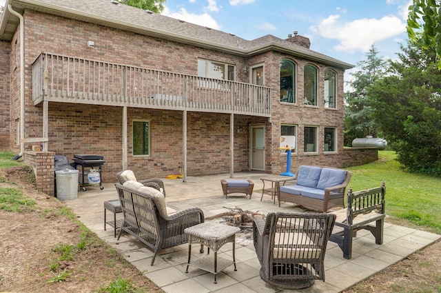 11976 N Northern Hts Dr, Brighton, MO 65617 - back of house with outdoor lounge area, a chimney, a patio, and brick siding