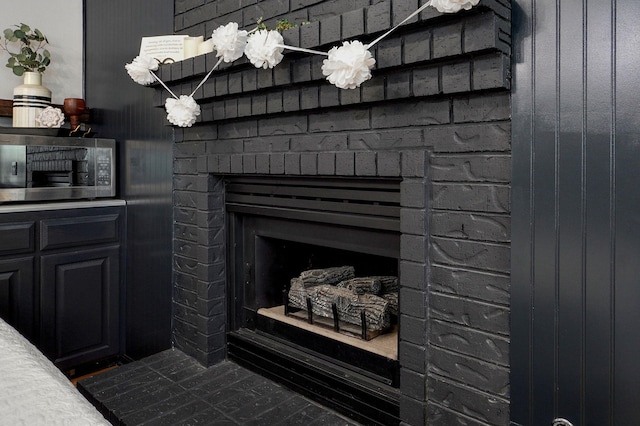 11976 N Northern Hts Dr, Brighton, MO 65617 - detailed view of stainless steel microwave and a brick fireplace
