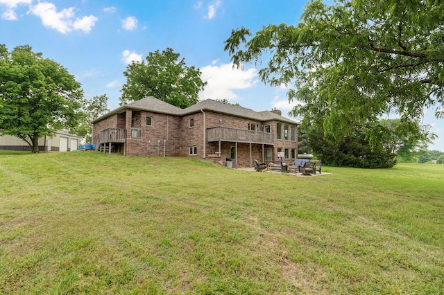 11976 N Northern Hts Dr, Brighton, MO 65617 - rear view of house with a lawn, brick siding, a chimney, a patio, and a wooden deck