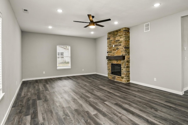 111 S Mill St, Rogersville, MO 65742 - unfurnished living room featuring ceiling fan, dark wood finished floors, a stone fireplace, baseboards, and recessed lighting
