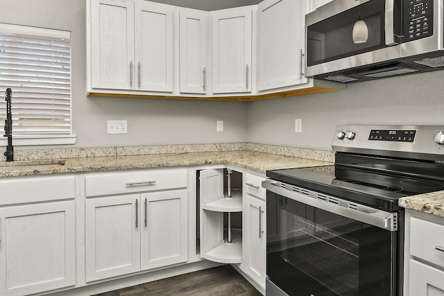 111 S Mill St, Rogersville, MO 65742 - kitchen with appliances with stainless steel finishes, a sink, and white cabinets