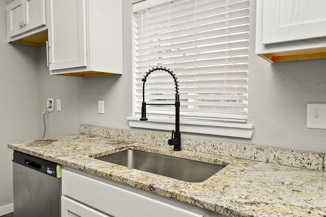 111 S Mill St, Rogersville, MO 65742 - kitchen featuring a sink, dishwasher, white cabinetry, and light stone counters