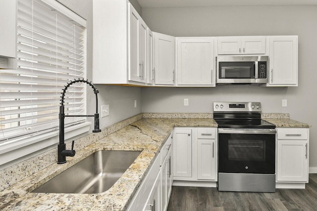 111 S Mill St, Rogersville, MO 65742 - kitchen with stainless steel appliances, a sink, dark wood-style floors, and white cabinetry