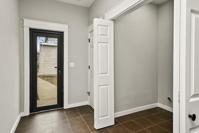 111 S Mill St, Rogersville, MO 65742 - washroom with dark tile patterned floors and baseboards