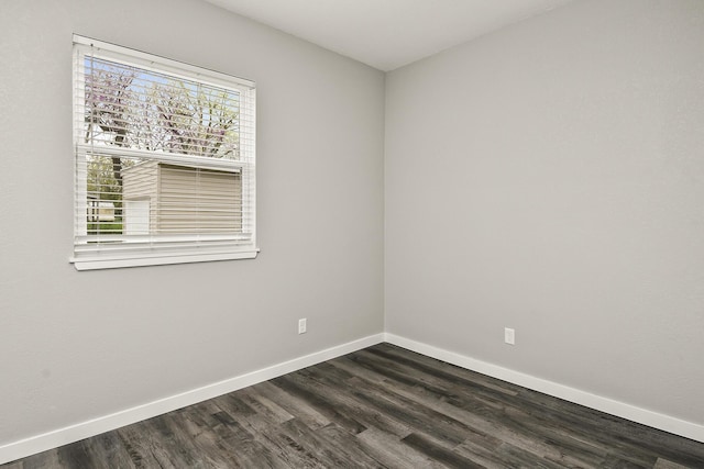 111 S Mill St, Rogersville, MO 65742 - spare room with baseboards and dark wood-type flooring