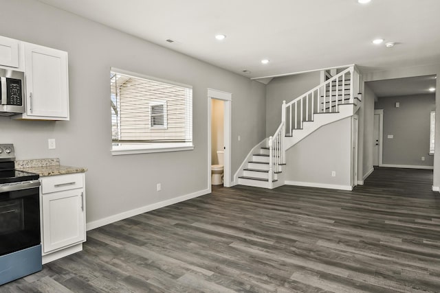 111 S Mill St, Rogersville, MO 65742 - kitchen with appliances with stainless steel finishes, dark wood-style flooring, white cabinetry, baseboards, and recessed lighting