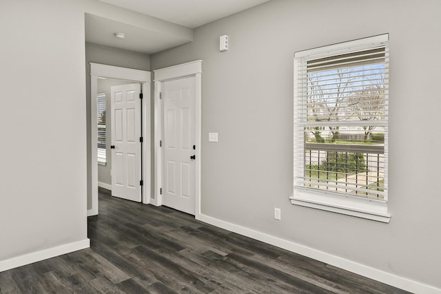 111 S Mill St, Rogersville, MO 65742 - foyer with baseboards and dark wood-style flooring
