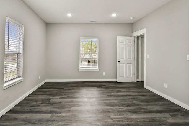 111 S Mill St, Rogersville, MO 65742 - empty room featuring plenty of natural light, recessed lighting, dark wood-type flooring, and baseboards