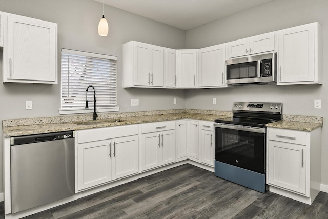 111 S Mill St, Rogersville, MO 65742 - kitchen featuring appliances with stainless steel finishes, a sink, white cabinetry, dark wood-type flooring, and light stone countertops