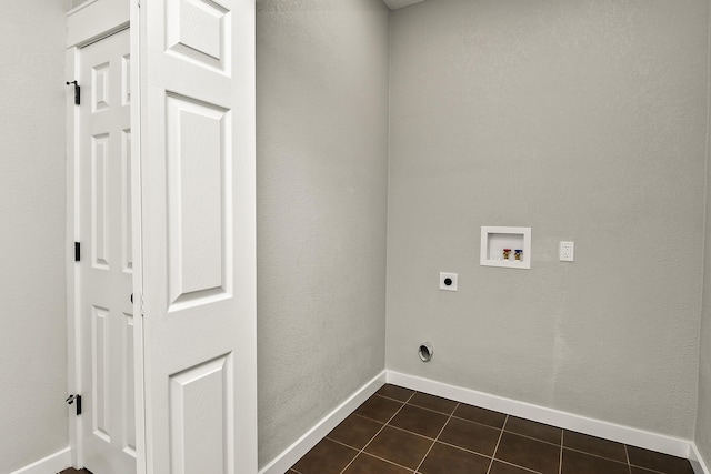 111 S Mill St, Rogersville, MO 65742 - laundry room with hookup for an electric dryer, hookup for a washing machine, dark tile patterned floors, and baseboards