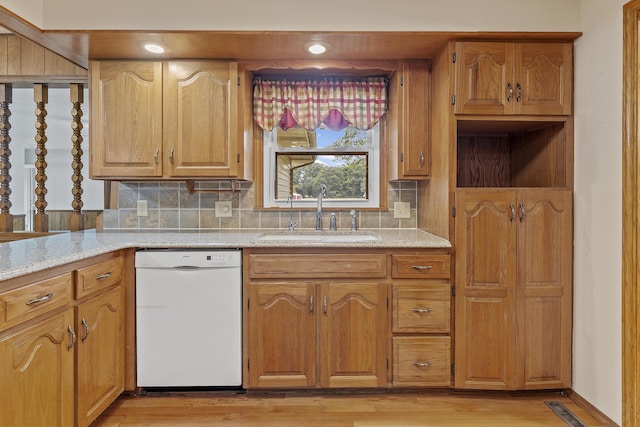 5263 N Crestwood Dr, Springfield, MO 65803 - kitchen with dishwasher, decorative backsplash, light wood-style floors, and light stone counters