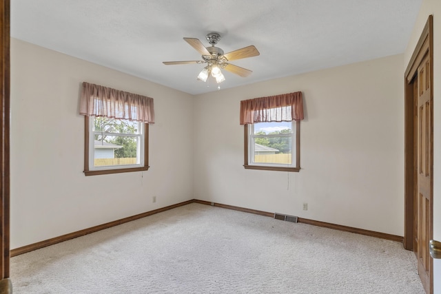 5263 N Crestwood Dr, Springfield, MO 65803 - unfurnished bedroom featuring light carpet, a closet, and a ceiling fan