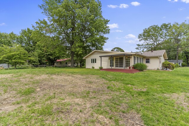 5263 N Crestwood Dr, Springfield, MO 65803 - view of green lawn featuring a deck