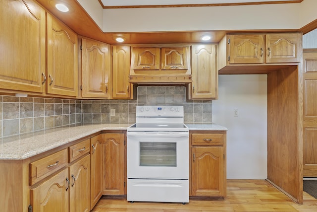 5263 N Crestwood Dr, Springfield, MO 65803 - kitchen featuring white electric range, decorative backsplash, light wood-type flooring, and light stone counters