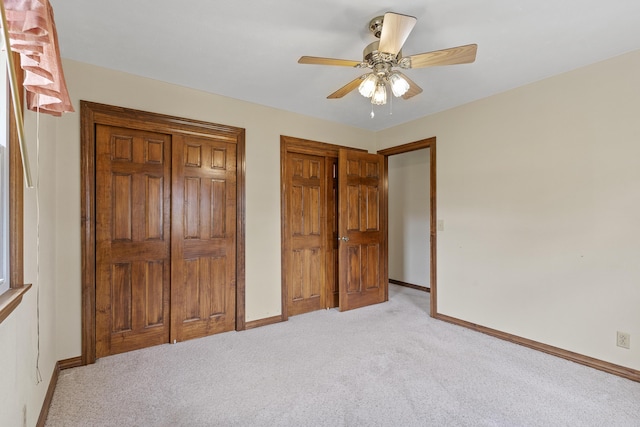 5263 N Crestwood Dr, Springfield, MO 65803 - bedroom featuring light colored carpet, multiple closets, and a ceiling fan