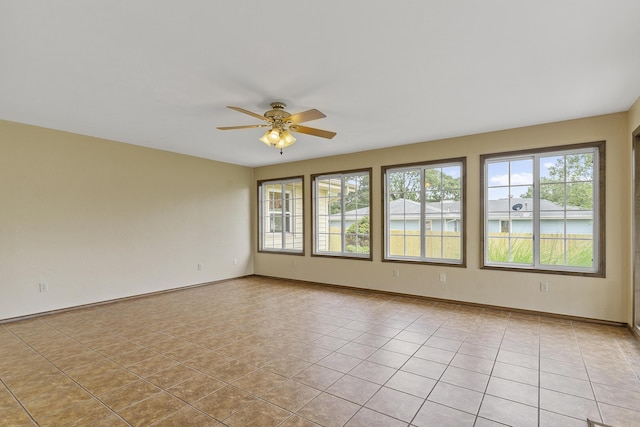 5263 N Crestwood Dr, Springfield, MO 65803 - empty room with a ceiling fan and light tile patterned flooring