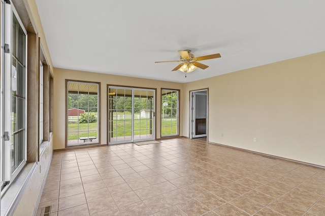 5263 N Crestwood Dr, Springfield, MO 65803 - unfurnished room with a ceiling fan and light tile patterned floors