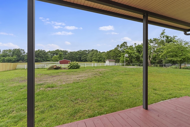 5263 N Crestwood Dr, Springfield, MO 65803 - view of yard with a wooden deck, view of wooded area, and an outdoor structure