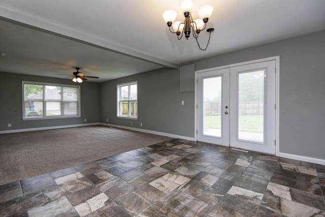 5364 Cloverdale Ln, Battlefield, MO 65619 - empty room with stone tile floors, baseboards, a chandelier, and french doors