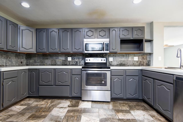 5364 Cloverdale Ln, Battlefield, MO 65619 - kitchen with appliances with stainless steel finishes, gray cabinets, a sink, and recessed lighting