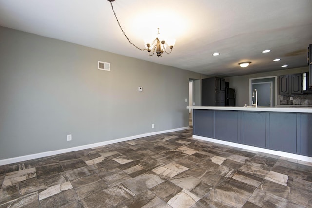 5364 Cloverdale Ln, Battlefield, MO 65619 - kitchen featuring freestanding refrigerator, a chandelier, recessed lighting, light countertops, and baseboards