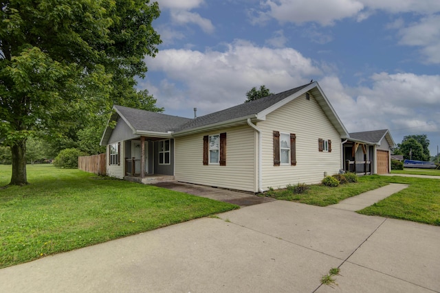 5364 Cloverdale Ln, Battlefield, MO 65619 - view of front of house featuring a front yard, concrete driveway, and a shingled roof