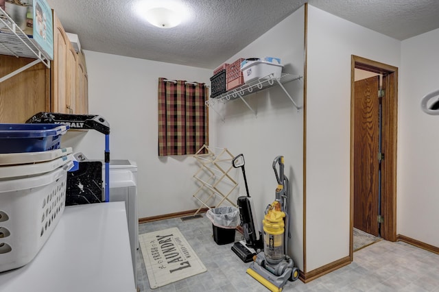1631 Robertson Ave, Carthage, MO 64836 - washroom with a textured ceiling and baseboards
