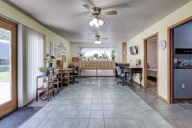 1631 Robertson Ave, Carthage, MO 64836 - tiled home office featuring healthy amount of natural light, ceiling fan, and a textured ceiling