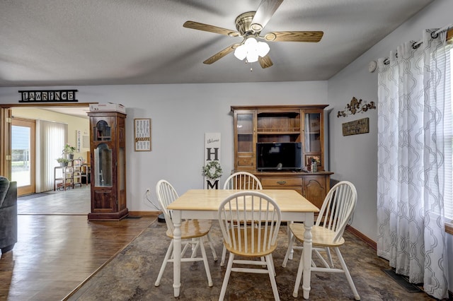 1631 Robertson Ave, Carthage, MO 64836 - dining space featuring a ceiling fan, baseboards, dark wood-style floors, and a textured ceiling