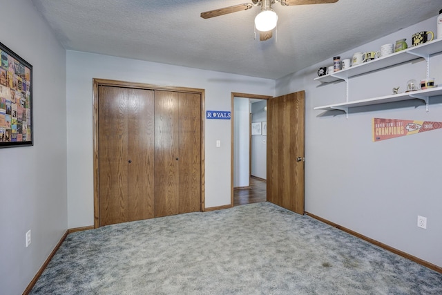1631 Robertson Ave, Carthage, MO 64836 - carpeted bedroom featuring a closet, baseboards, a ceiling fan, and a textured ceiling