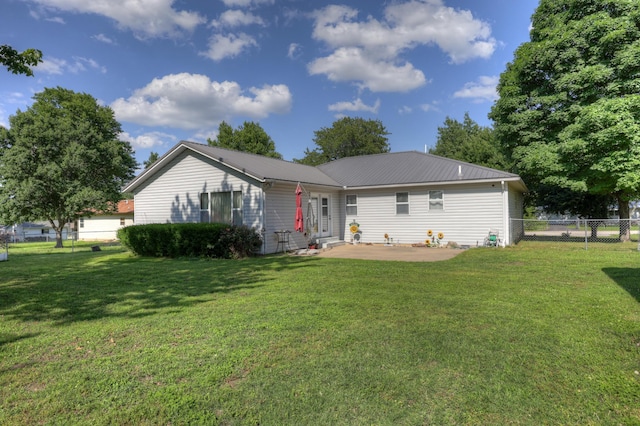 1631 Robertson Ave, Carthage, MO 64836 - back of house with a patio area and metal roof