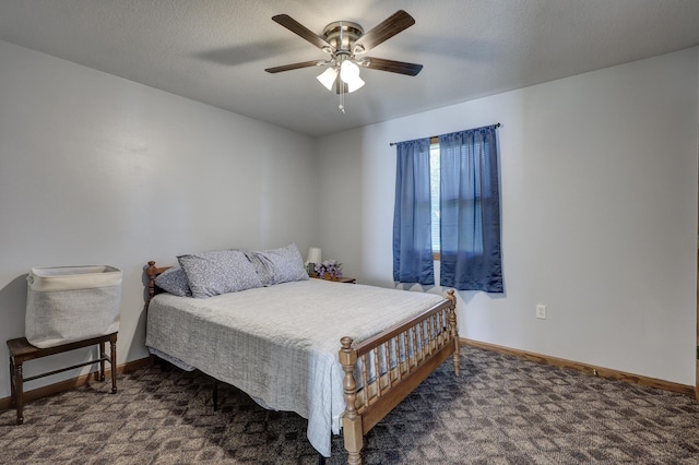 1631 Robertson Ave, Carthage, MO 64836 - bedroom featuring baseboards, a ceiling fan, and dark colored carpet