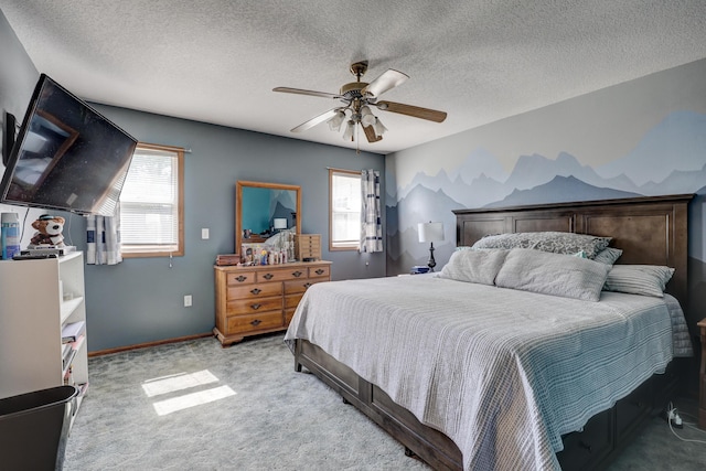 1631 Robertson Ave, Carthage, MO 64836 - bedroom with multiple windows, light carpet, a ceiling fan, a textured ceiling, and baseboards