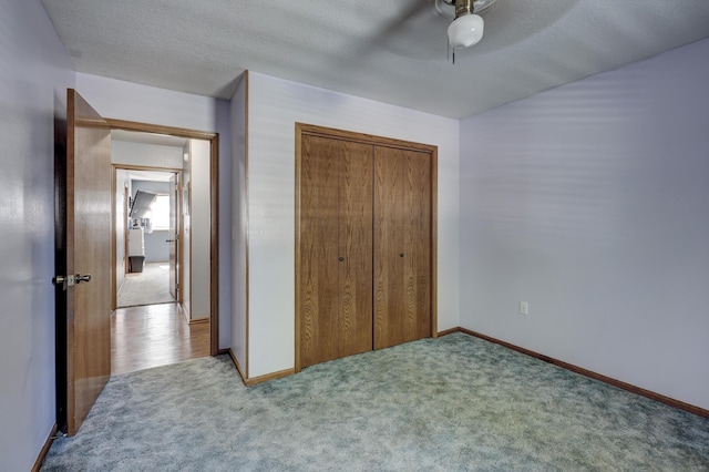 1631 Robertson Ave, Carthage, MO 64836 - carpeted bedroom with a closet, baseboards, and a ceiling fan