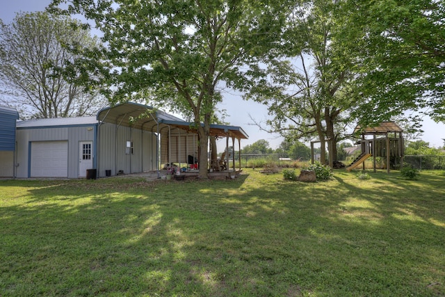 1631 Robertson Ave, Carthage, MO 64836 - view of yard with a playground, a garage, and a carport