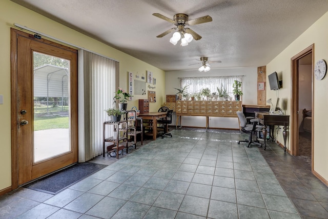 1631 Robertson Ave, Carthage, MO 64836 - home office featuring a textured ceiling and ceiling fan