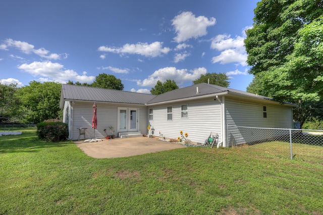 1631 Robertson Ave, Carthage, MO 64836 - back of house with a patio area and metal roof