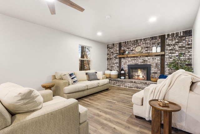3050 Montague Ln, Kimberling City, MO 65686 - living area featuring wood finished floors, a fireplace, ceiling fan, and recessed lighting