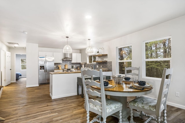 3050 Montague Ln, Kimberling City, MO 65686 - dining space featuring dark wood-type flooring and baseboards