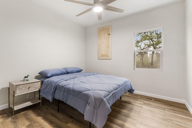 3050 Montague Ln, Kimberling City, MO 65686 - bedroom featuring baseboards, wood finished floors, and a ceiling fan