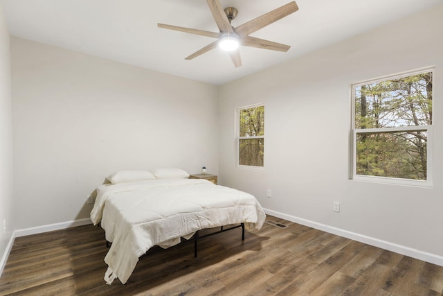 3050 Montague Ln, Kimberling City, MO 65686 - bedroom with baseboards, multiple windows, and wood finished floors