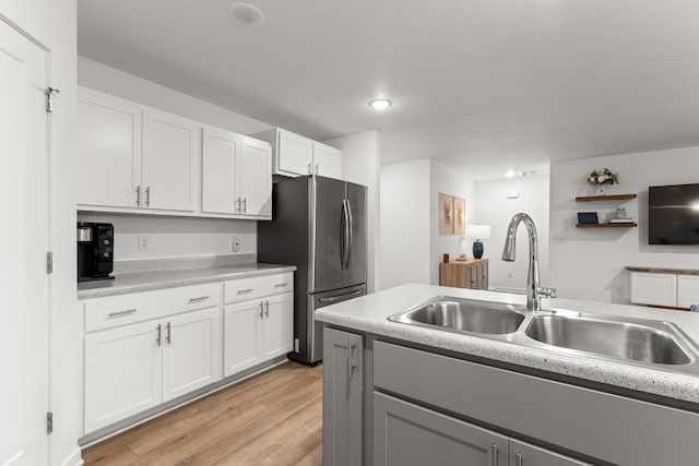 565 S Michelle Ave, Republic, MO 65738 - kitchen with freestanding refrigerator, a sink, light countertops, light wood finished floors, and recessed lighting