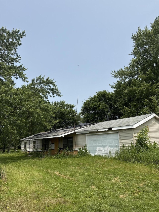 10103 E 1st St, Butterfield, MO 65625 - view of front of home with a garage and a front yard