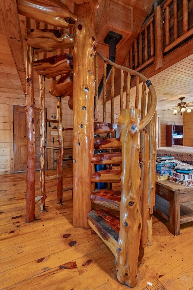 447 Flint Ln, Washburn, MO 65772 - staircase featuring hardwood / wood-style flooring and wooden walls