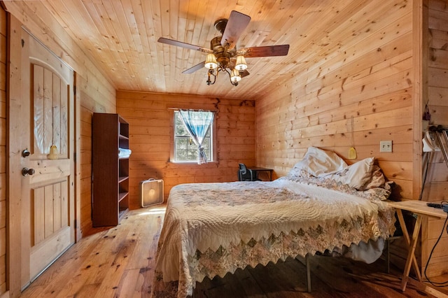 447 Flint Ln, Washburn, MO 65772 - bedroom featuring hardwood / wood-style flooring, wood ceiling, wooden walls, and ceiling fan