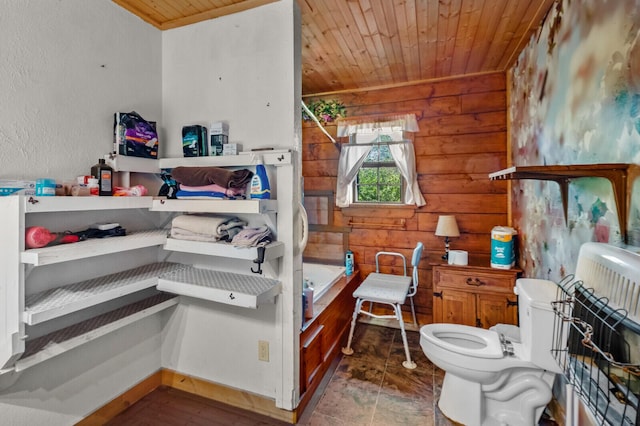 447 Flint Ln, Washburn, MO 65772 - full bathroom featuring wooden ceiling, toilet, wood walls, a textured wall, and bathtub / shower combination
