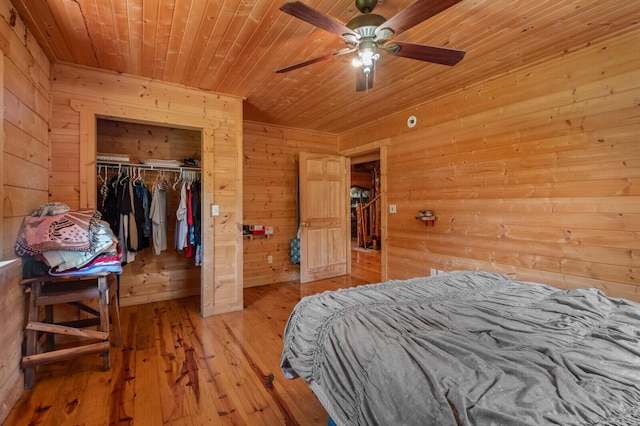 447 Flint Ln, Washburn, MO 65772 - bedroom with wooden walls, wooden ceiling, hardwood / wood-style flooring, a closet, and a ceiling fan