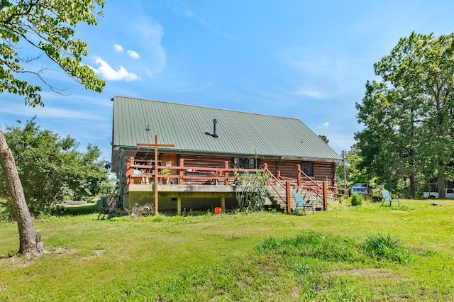 447 Flint Ln, Washburn, MO 65772 - rear view of property featuring metal roof, log exterior, a lawn, and a deck